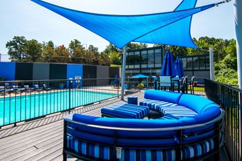 Covered poolside lounge & dining areas